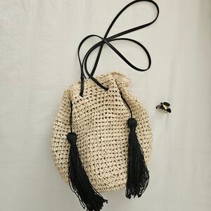 Elegant Cream Woven Bag with Black Tassels